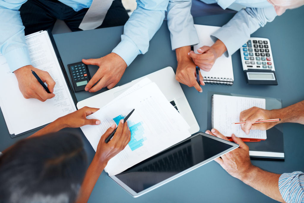 Cropped image of hands of businesspeople working together on business project at office - Consulting